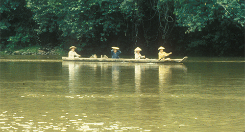 Four adulsts in a log pirogue