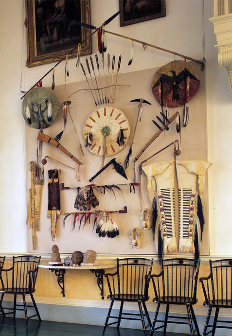 A collection of Indian weapons hanging on the wall
