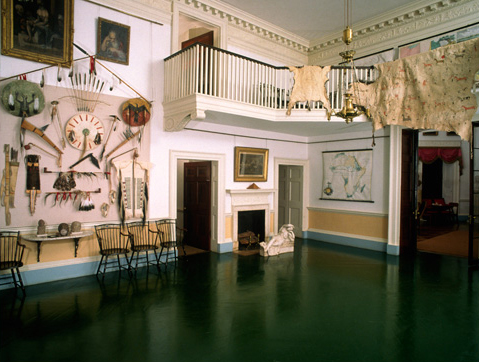 Indian Hall with Indian artifacts and animal skins hanging on all the walls