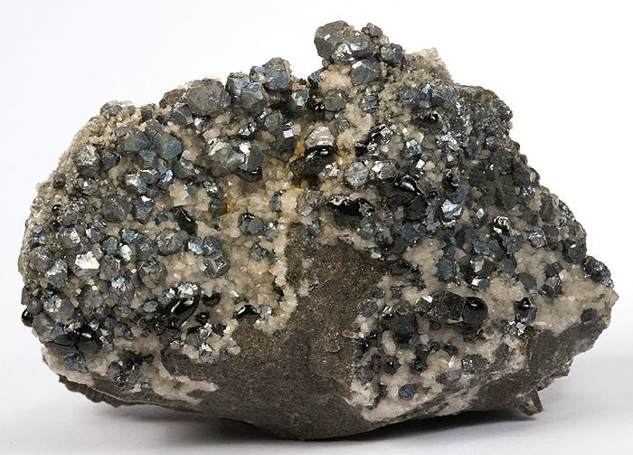 Dark lead crystals mixed with crystals of white quartz