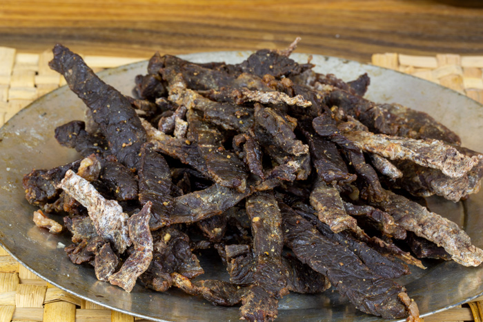 A plate full of dried meat strips