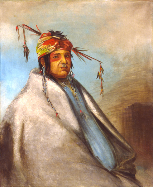Indian wearing white fur robe and colorful turban