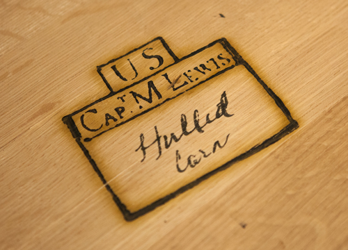 Rectangular box with Lewis's name burned in wood and written in pencil, 'Hulled Corn'