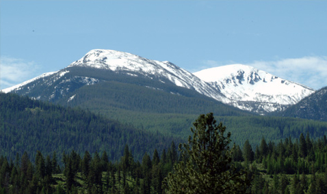 two rounded peaks covered with snow