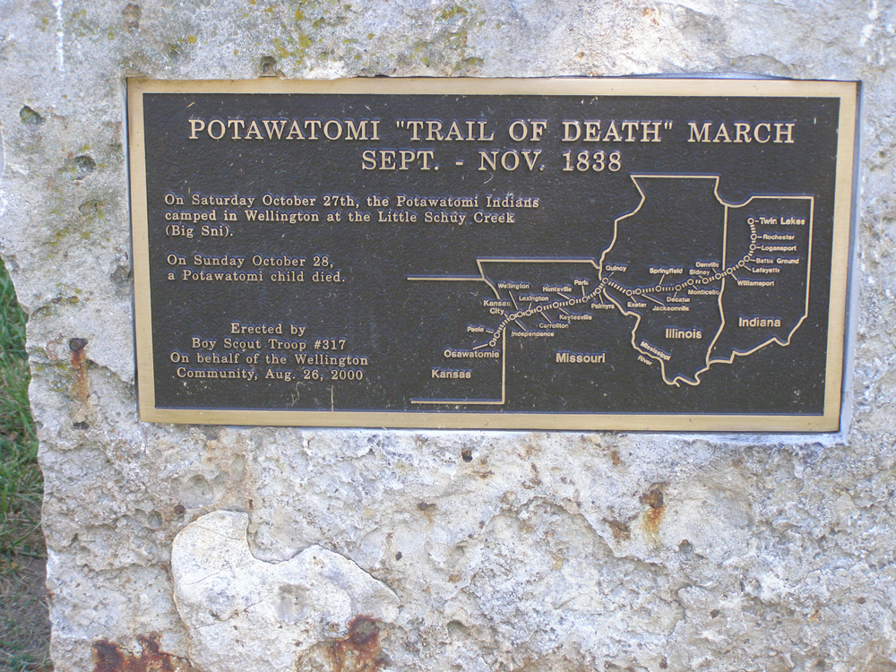 Brass marker mounted on a rock with map of the Trail of Death